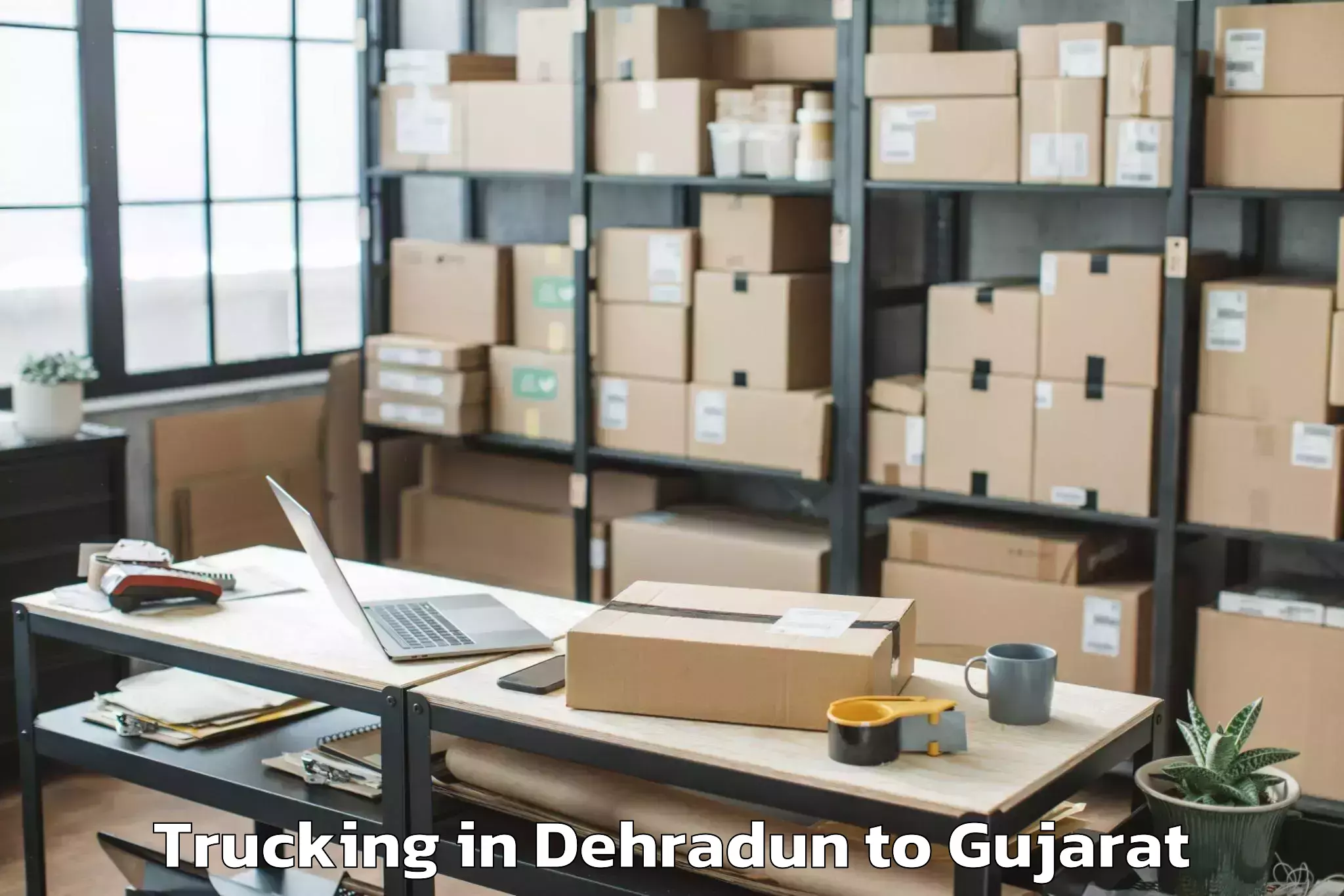 Get Dehradun to Dhuvaran Trucking